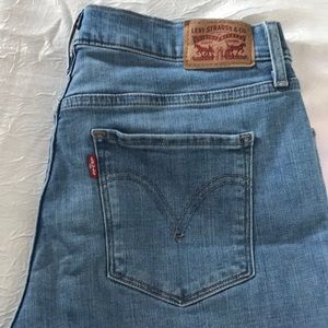 Medium wash blue jeans with ribbon cuffs